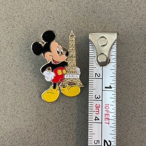 Disney pin trading Mickey Mouse with Eiffel Tower